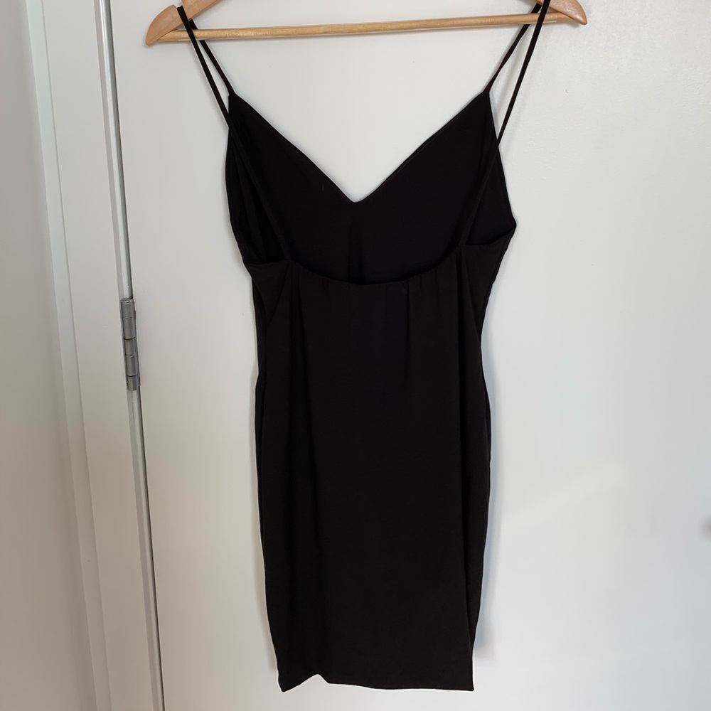 Sleeveless Lbd with ruched low back detail.
